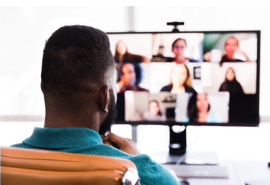 A man sitting in front of a television.