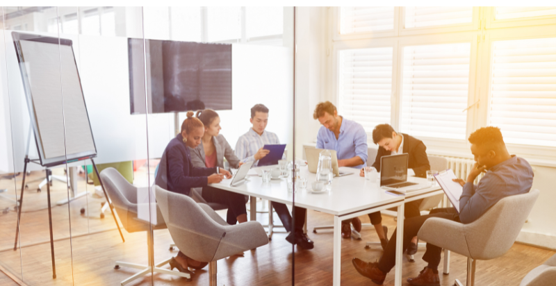 A group of people sitting around a table.