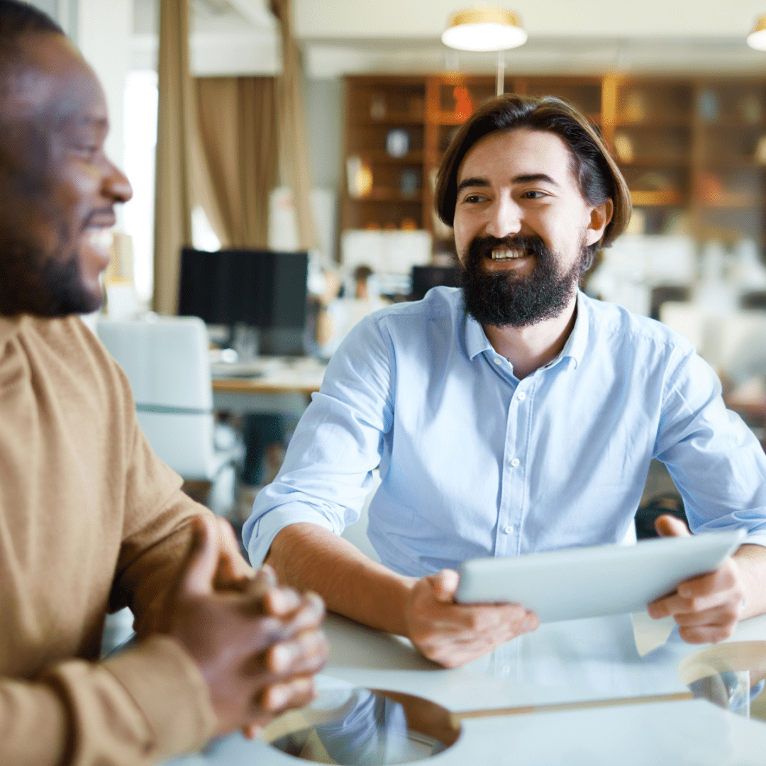 Two people talking during a candidate assessment interview